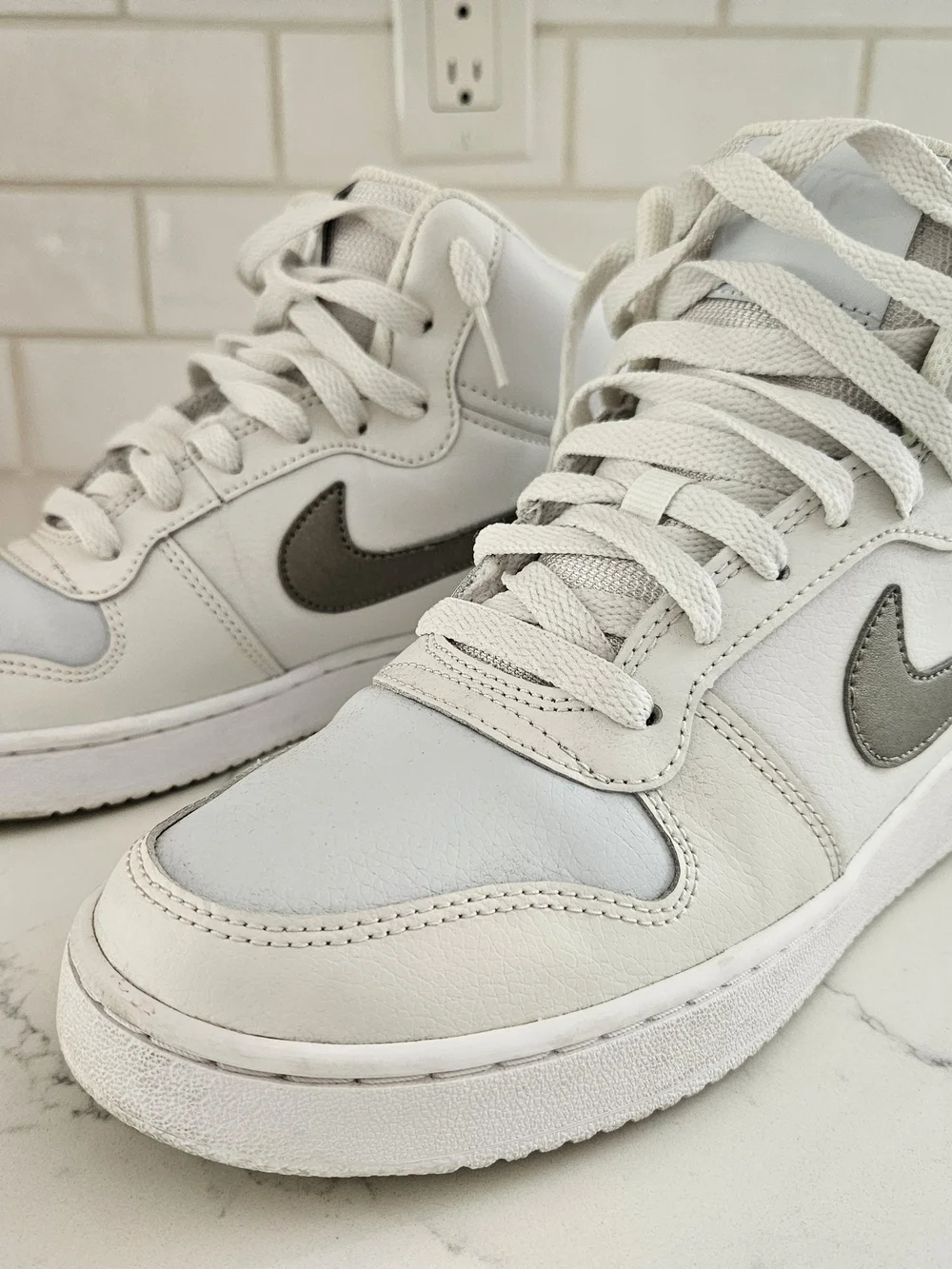 Nike Women's White Leather High-Top Sneakers with Grey Swoosh